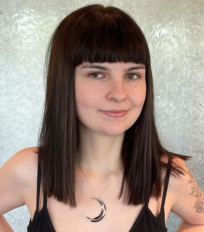 Haircut with No Layers and Thick Blunt Bangs