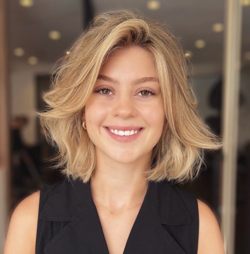 Playful Blonde Haircut with Side Fringe