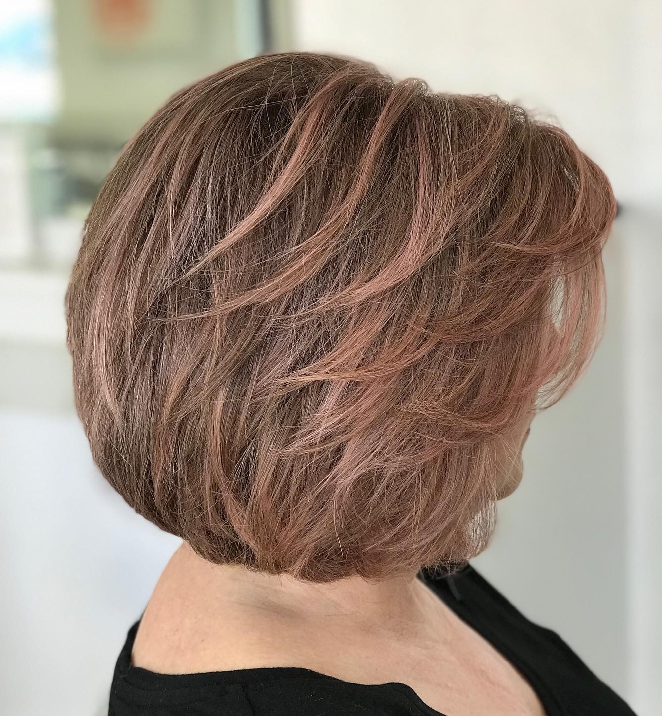 Short Layered Hairstyle in Rose Gold Tones