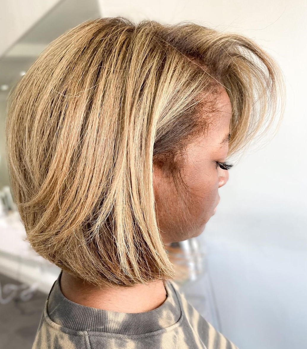 Warm Blonde Bob with Side Swept Bangs on Natural Hair