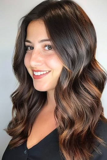 Chocolate Brown Wave with Chestnut Balayage Hairstyle on smiling woman with brown hair.