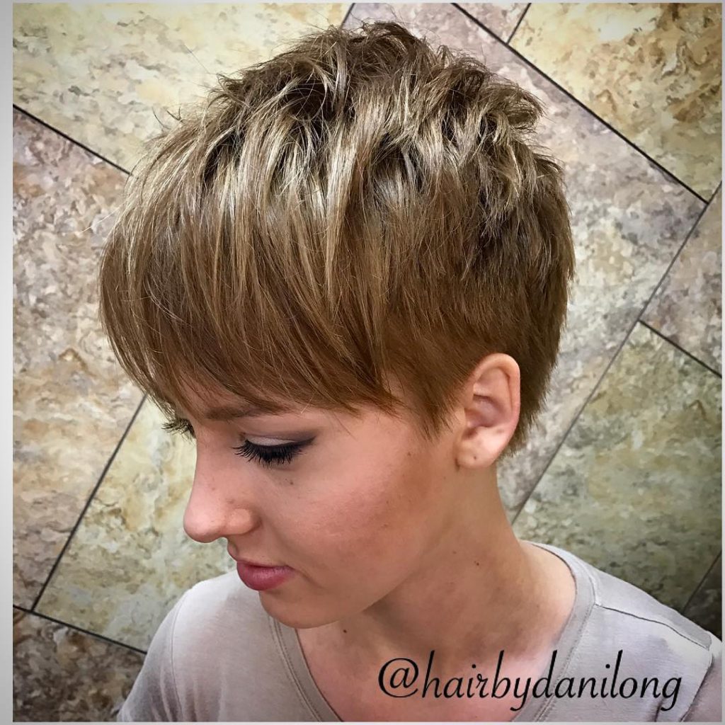 dark blonde pixie cut with bangs