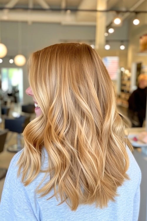 Golden strawberry blond hair color, back view.