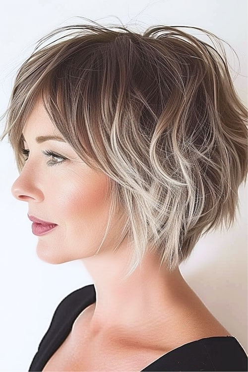 Ombre pixie cut on older woman, side view.