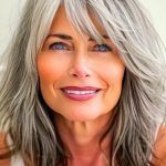 textured-gray-layers-with-bangs-haircut-on-smiling