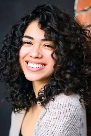 Voluminous Curls Shoulder-Length Haircut.