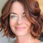 wavy-bob-hairstyle-on-a-smiling-woman-with-auburn