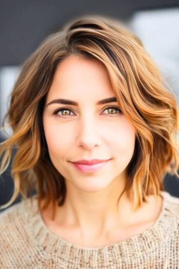 Wavy Textured Bob Hairstyle on a woman with brown hair and highlights.