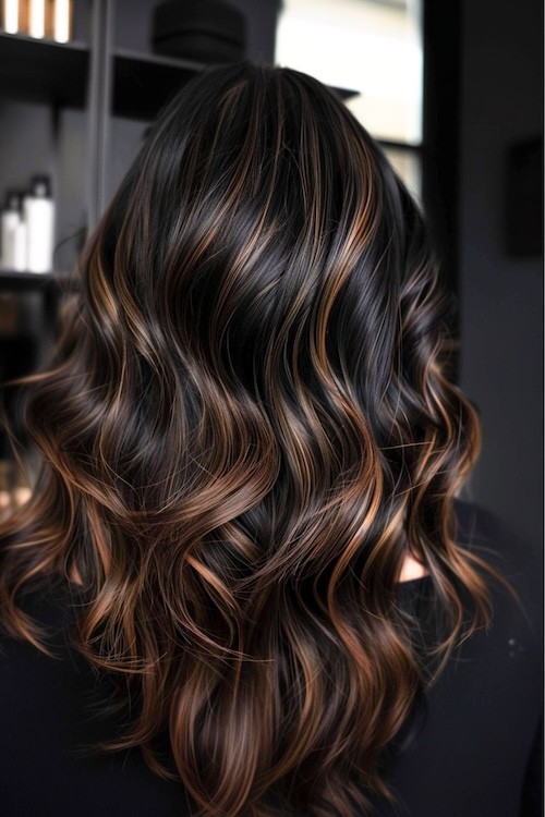 Black brown hair with golden highlights hair color.