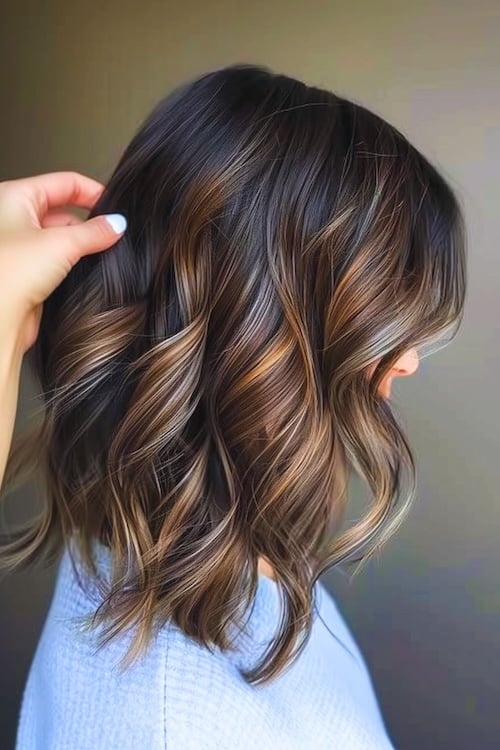 Bright babylights on dark chocolate brown hair color.