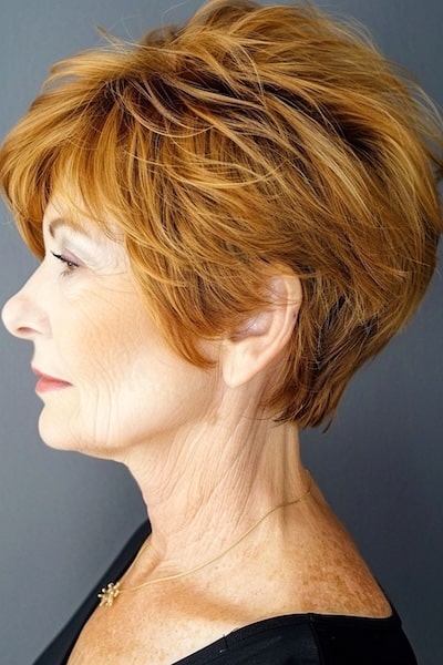 Copper feathered pixie on woman in her 50s.