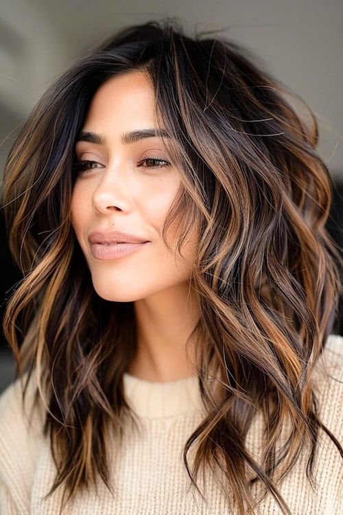 Dark brown hair color with hazelnut highlights.