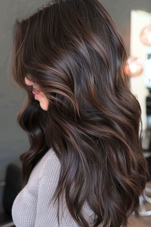 Dark brown hair with medium brown highlights.