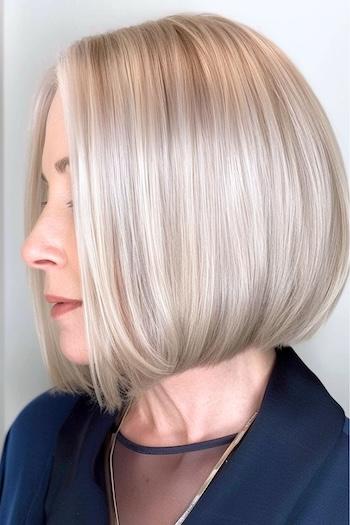 Sleek Ash Blonde Bob Hairstyle on a woman with blonde hair side view.