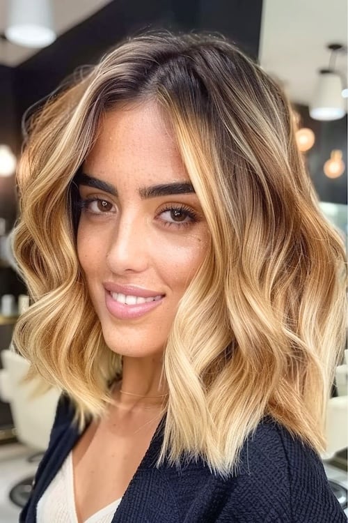 Strong golden balayage on dark brown hair.