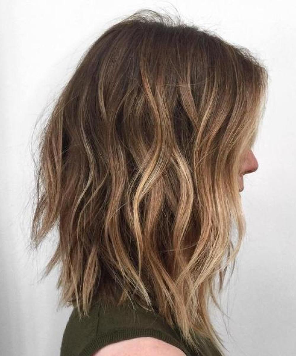 long choppy bob with light brown balayage