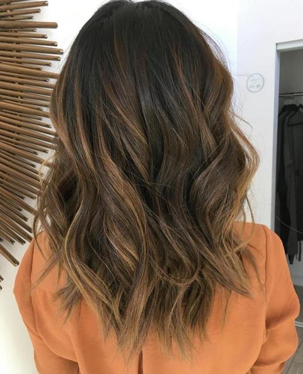 medium dark brown hair with caramel balayage