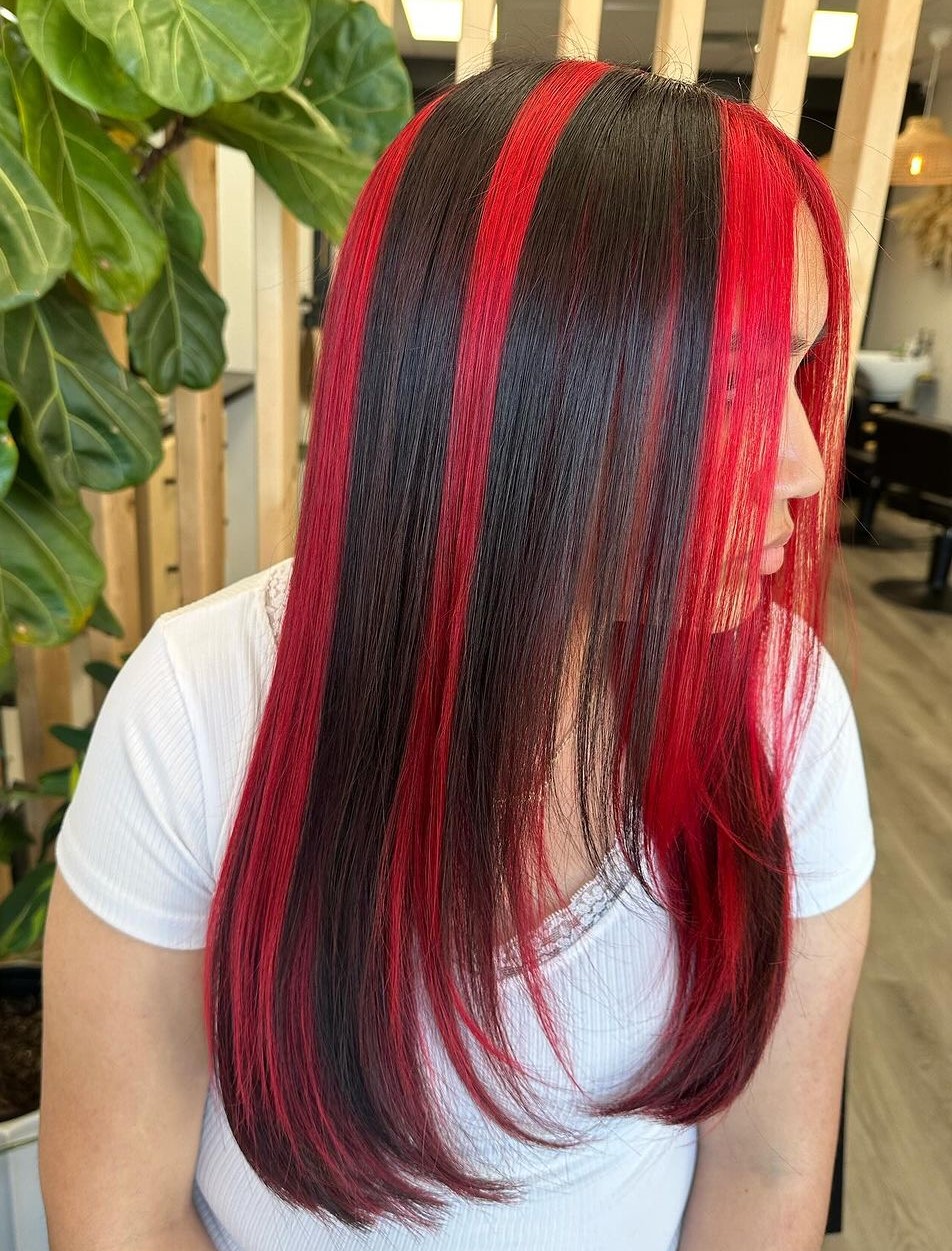 Red Skunk Streak Highlights on Dark Hair