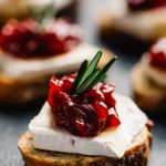 a-cranberry-brie-bite-toasted-baguette-topped-wi