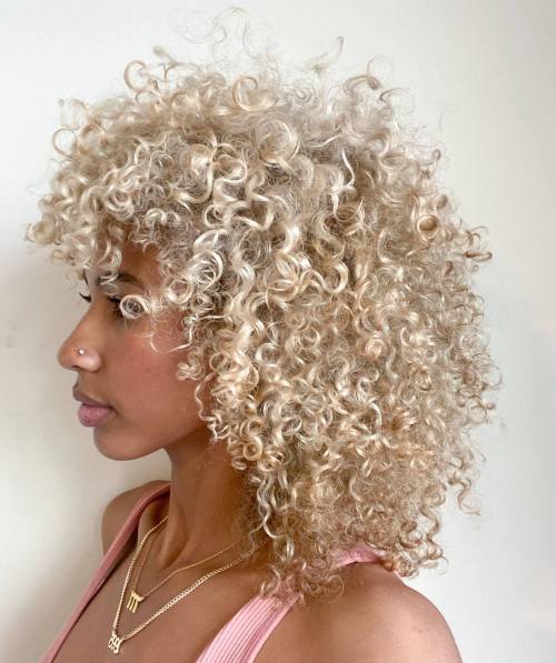 Shoulder Grazing Beige Blonde Curls