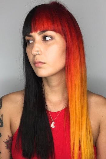 Fiery Dual-Tone Long Hair With Blunt Bangs Hairstyle on a woman with long straight hair.