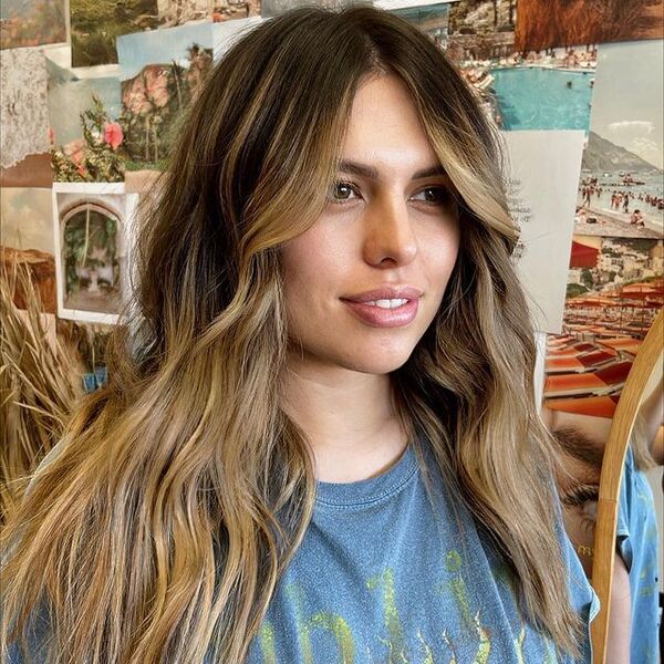 a woman wearing a blue printed shirt