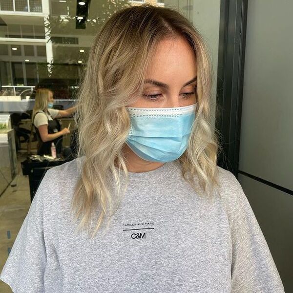 a woman wearing a surgical facemask