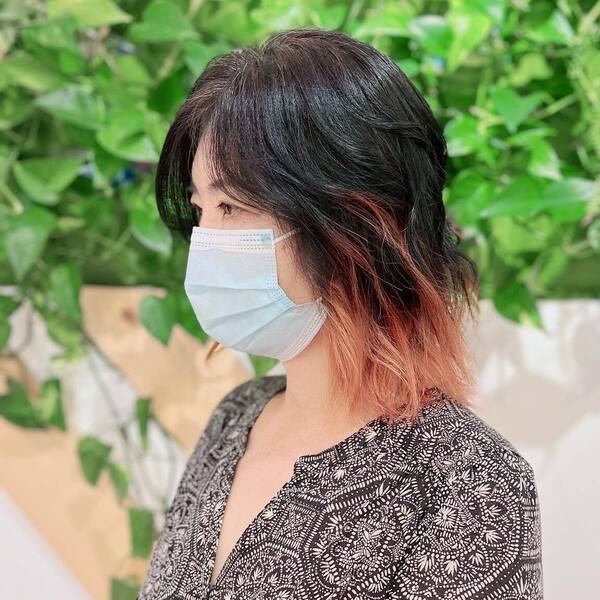 a woman wearing a surgical facemask