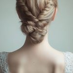 a-woman-with-a-braided-low-bun-with-twists-wearin