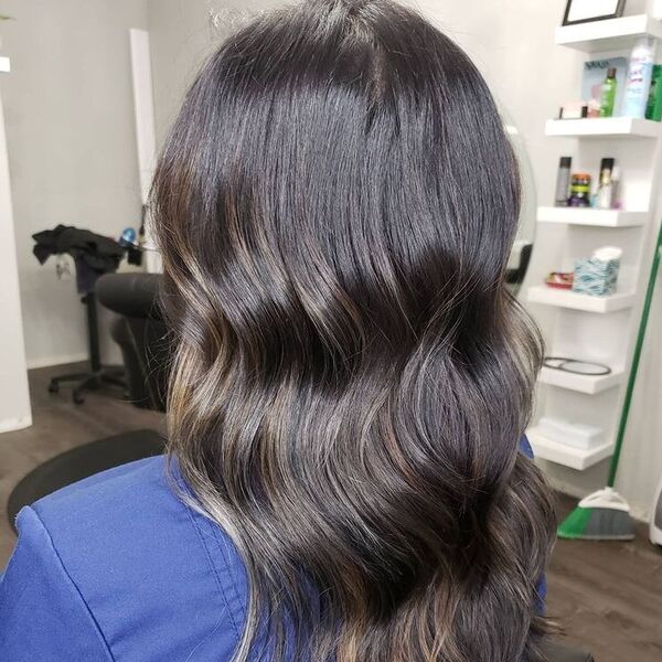 Balayage on Black Hair - a woman wearing blue violet denim jacket.