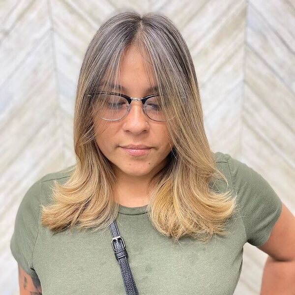 blonde ombre - a woman wearing a eyeglasses