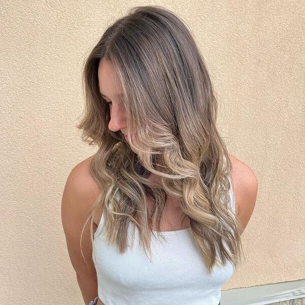 blonde ombre - a woman wearing a white top