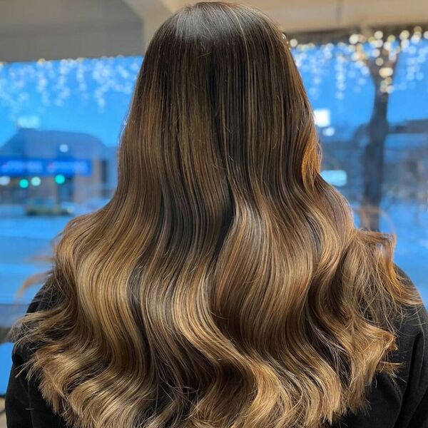 Brownie Light Brown Hair - a woman wearing a black sweater