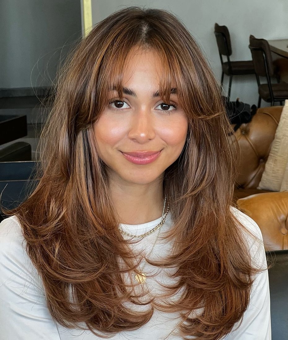 Butterfly Haircut with Curtain Bangs for a Round Face