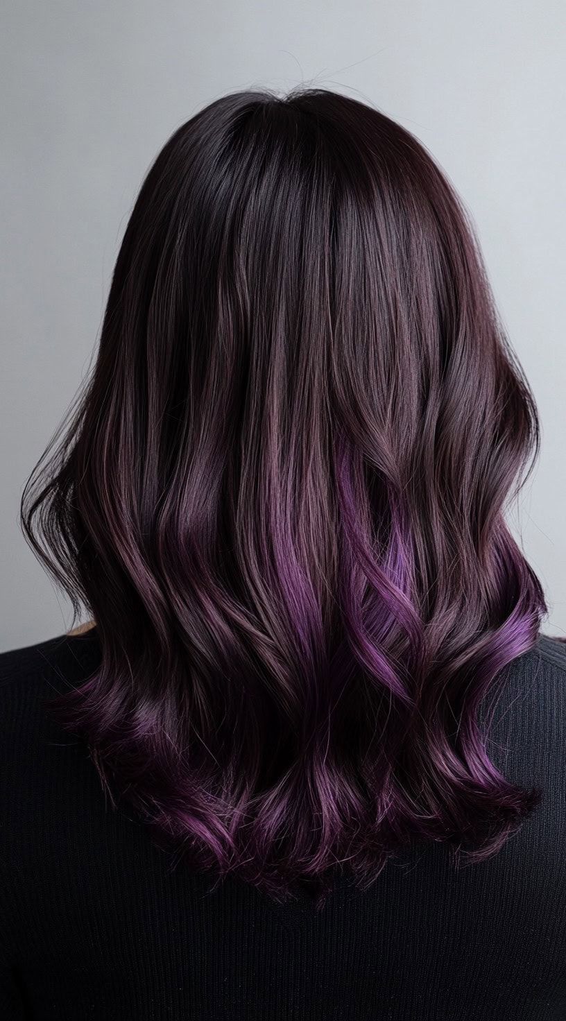 Dark brown hair fading into deep plum purple waves.