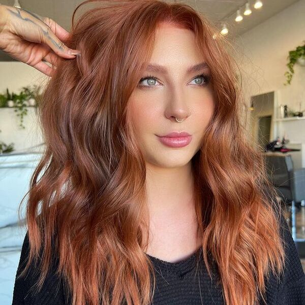 Dark Strawberry Blonde Hair - a woman wearing a black longsleeve