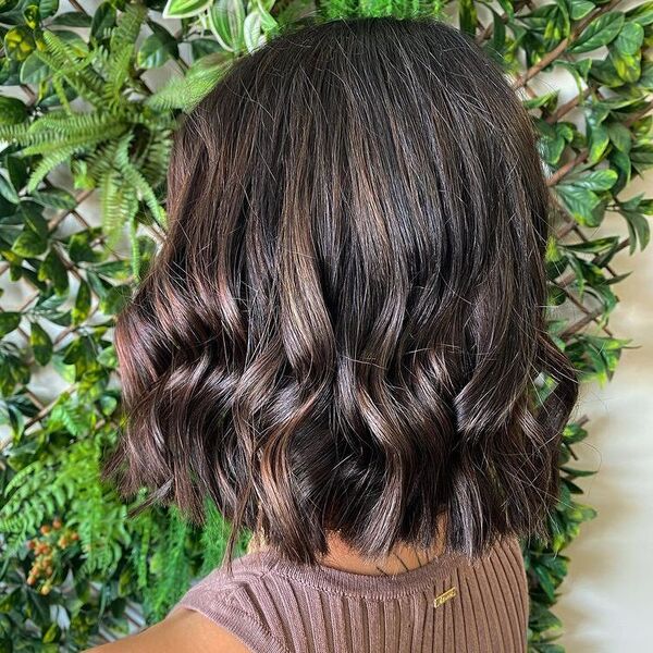 Darker Style with Balayage - a woman wearing brown knitted tank top.