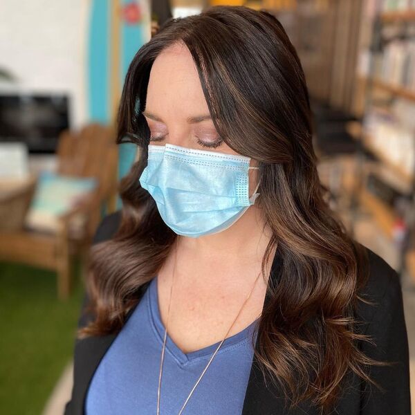 Fresh Toner Glaze - a woman wearing mask in black coat with purple under shirt.