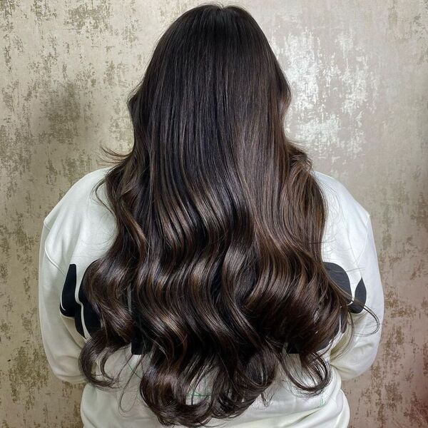 Glamourous Auburn Curls - a woman wearing white sweater.