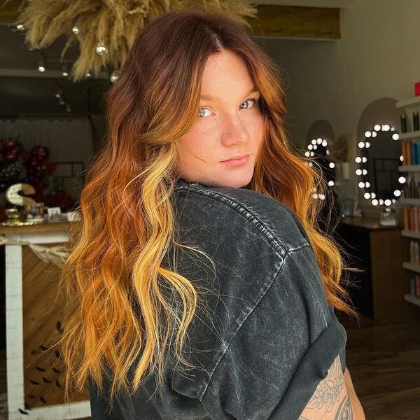 Golden Strawberry Blonde Hair - a woman with tattoo wearing a denim blouse