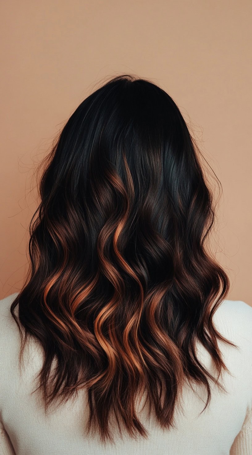 In this photo, dark chocolate brown waves are accented with subtle copper highlights, adding a warm glow to the hair.