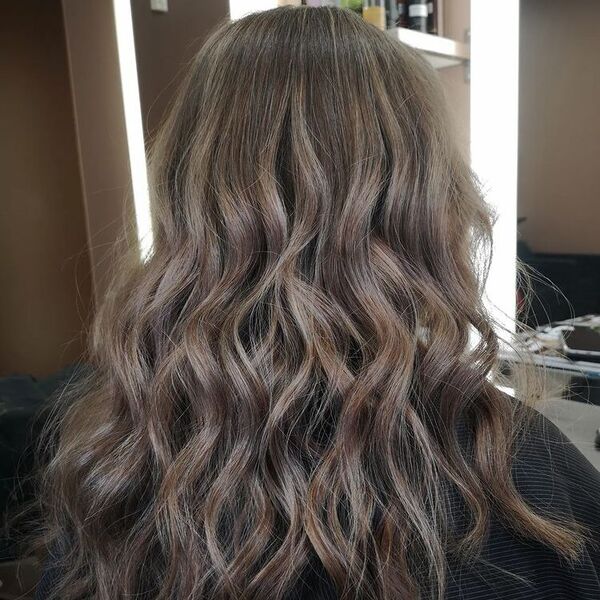 Latte Balayage - a woman wearing a black cape