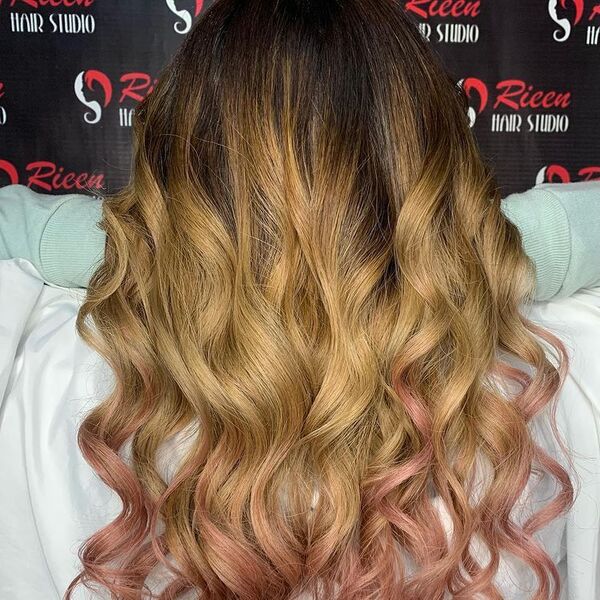 Light Brown Hair with Dusty Rose Gold - a woman wearing a white cape and is holding her hair