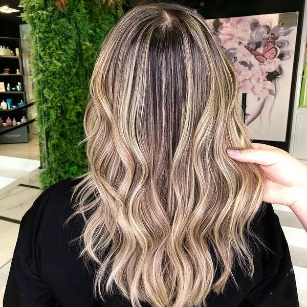 Light Brown Ombre Hair - a woman wearing a black shirt