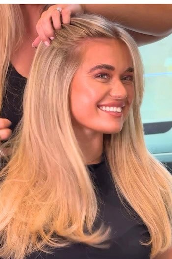 Long Honey Blonde Hair on a smiling woman with blonde hair.