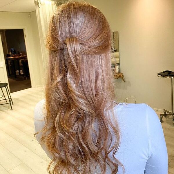 Pastel Pink Strawberry Blonde Hair - a woman wearing a white longsleeve