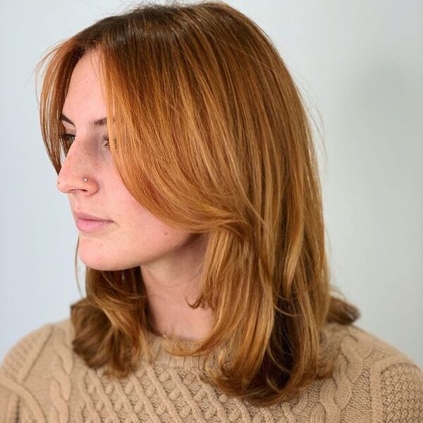 Shoulder-Length Strawberry Blonde Hair - a woman wearing a brown longsleeve