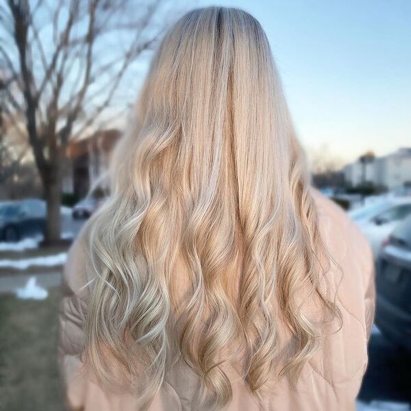 Silver Blonde Hair - a woman wearing a baby pink coat