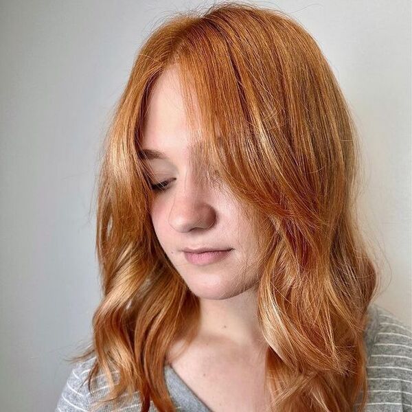 Strawberry Brown Blonde Hair - a woman wearing a stripe blouse