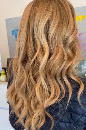 Warm Caramel Blonde Piecey Waves on a woman with long blonde hair, back view.